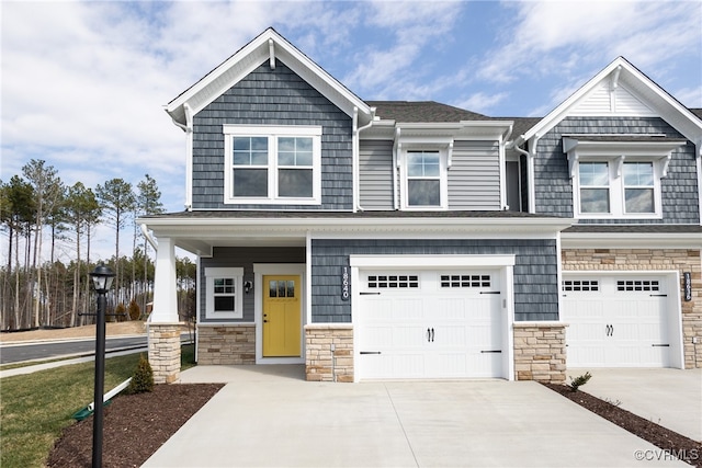 18767 Palisades Rdg, Moseley, VA 23120 - craftsman-style home featuring concrete driveway, stone siding, and an attached garage