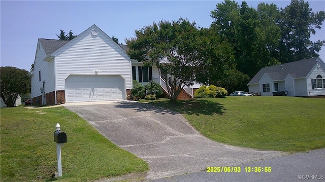 7962 Baneberry Dr, Mechanicsville, VA 23111 - single story home featuring asphalt driveway, a front yard, brick siding, and an attached garage