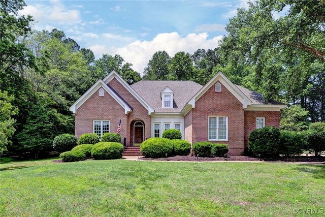 2520 Nathaniell Powell Rd, Williamsburg, VA 23185 - view of front facade with brick siding and a front lawn