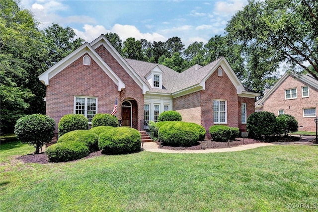 2520 Nathaniell Powell Rd, Williamsburg, VA 23185 - traditional-style house with brick siding and a front lawn