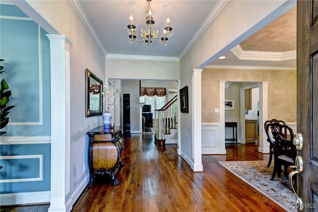 2520 Nathaniell Powell Rd, Williamsburg, VA 23185 - entrance foyer with decorative columns, wood finished floors, stairs, crown molding, and wainscoting