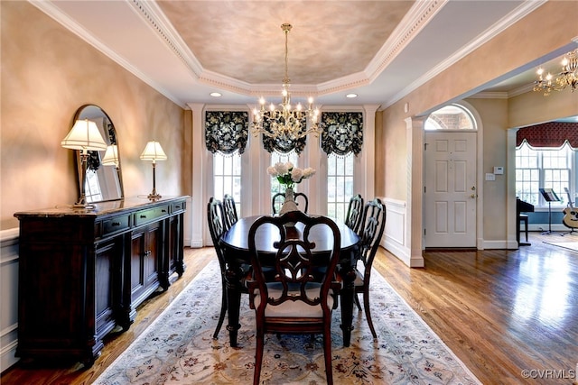2520 Nathaniell Powell Rd, Williamsburg, VA 23185 - dining space featuring a chandelier, a tray ceiling, light wood finished floors, and crown molding