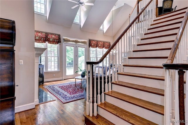 2520 Nathaniell Powell Rd, Williamsburg, VA 23185 - foyer with stairway, plenty of natural light, a towering ceiling, a ceiling fan, and wood finished floors