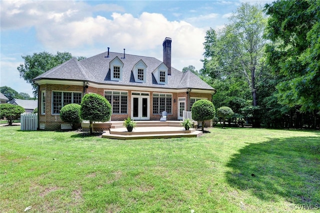 2520 Nathaniell Powell Rd, Williamsburg, VA 23185 - rear view of property featuring french doors, brick siding, and a lawn