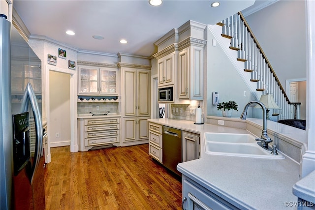 2520 Nathaniell Powell Rd, Williamsburg, VA 23185 - kitchen featuring stainless steel appliances, cream cabinetry, light countertops, tasteful backsplash, and dark wood-style flooring