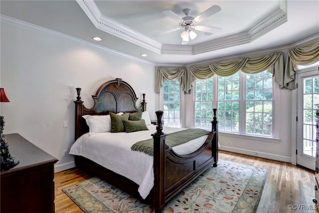 2520 Nathaniell Powell Rd, Williamsburg, VA 23185 - bedroom featuring ornamental molding, a raised ceiling, light wood-style floors, a ceiling fan, and access to exterior