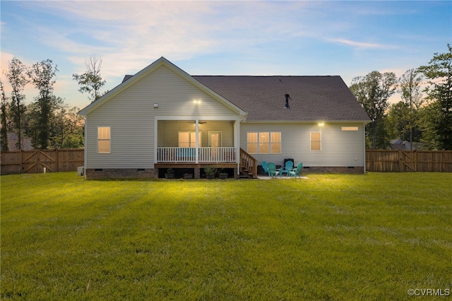 12025 Autumn Knoll Dr, Mechanicsville, VA 23116 - back of property at dusk featuring crawl space, a fenced backyard, a deck, and roof with shingles