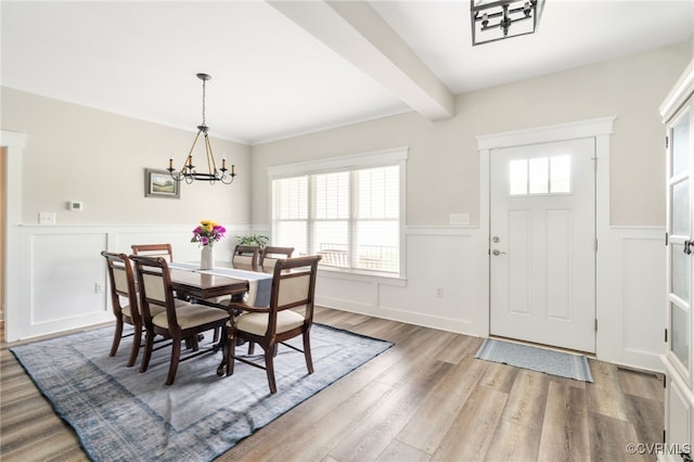12025 Autumn Knoll Dr, Mechanicsville, VA 23116 - dining room with a wainscoted wall, a decorative wall, wood finished floors, a chandelier, and beam ceiling