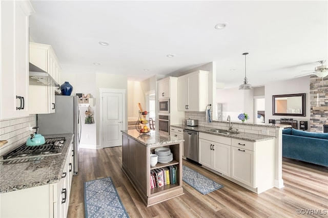12025 Autumn Knoll Dr, Mechanicsville, VA 23116 - kitchen with stainless steel appliances, open shelves, backsplash, wood finished floors, and white cabinetry