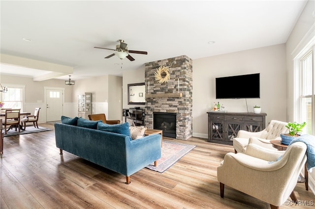 12025 Autumn Knoll Dr, Mechanicsville, VA 23116 - living room with plenty of natural light, light wood-type flooring, ceiling fan, and wainscoting