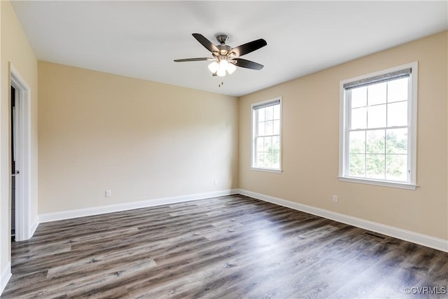 8315 Namozine Rd, Amelia Courthouse, VA 23002 - spare room featuring dark wood-type flooring, baseboards, and a ceiling fan