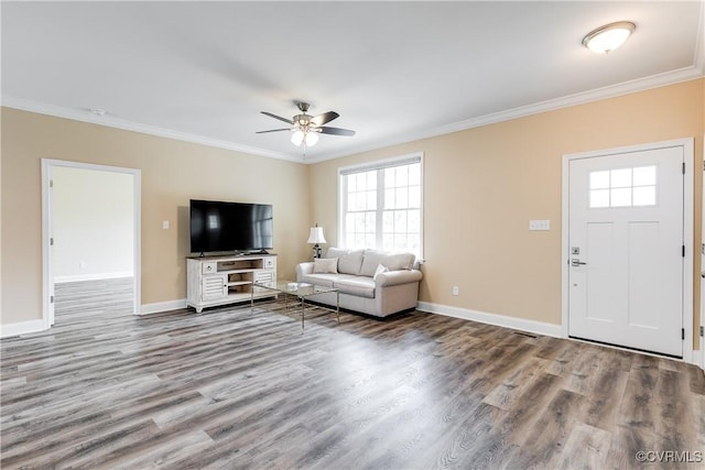 8315 Namozine Rd, Amelia Courthouse, VA 23002 - living room featuring crown molding, wood finished floors, a ceiling fan, healthy amount of natural light, and baseboards