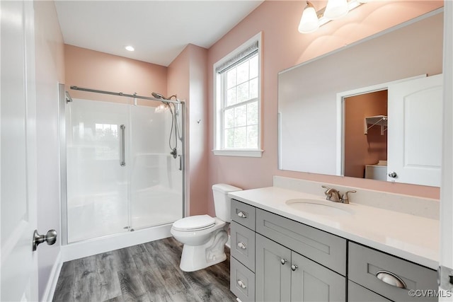 8315 Namozine Rd, Amelia Courthouse, VA 23002 - bathroom featuring toilet, a stall shower, vanity, and wood finished floors
