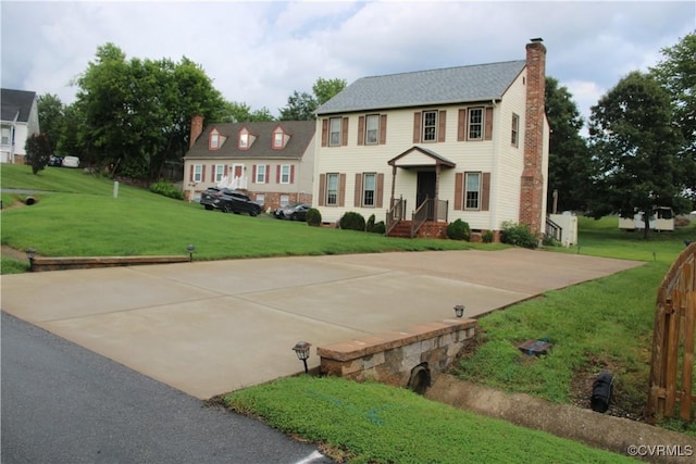 8318 Banshire Ct, Hanover, VA 23111 - colonial home featuring a chimney and a front lawn