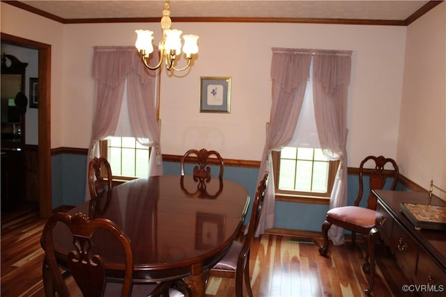 8318 Banshire Ct, Hanover, VA 23111 - dining space with hardwood / wood-style flooring, a chandelier, and ornamental molding