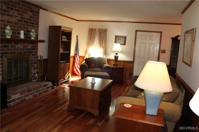 8318 Banshire Ct, Hanover, VA 23111 - living room with dark wood finished floors, a wainscoted wall, crown molding, a brick fireplace, and wood walls