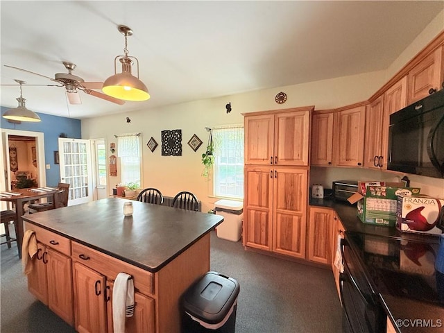 12509 Sam Snead Hwy, Warm Springs, VA 24484 - kitchen with black microwave, dark countertops, a ceiling fan, dark colored carpet, and hanging light fixtures