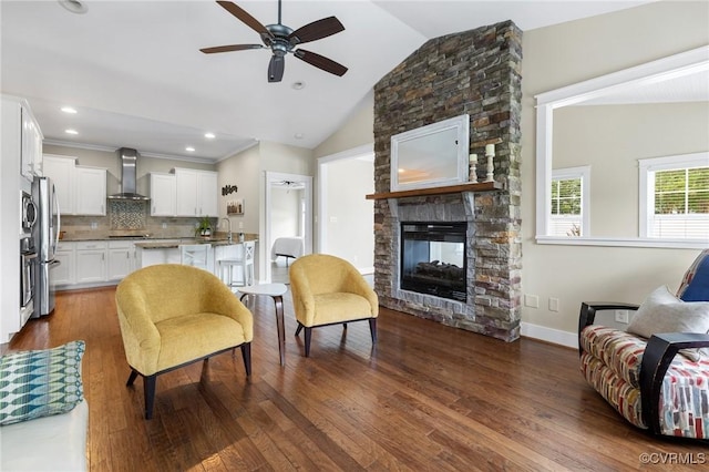 7500 Nicklaus Cir, Moseley, VA 23120 - living area with a ceiling fan, lofted ceiling, a fireplace, dark wood-style flooring, and recessed lighting