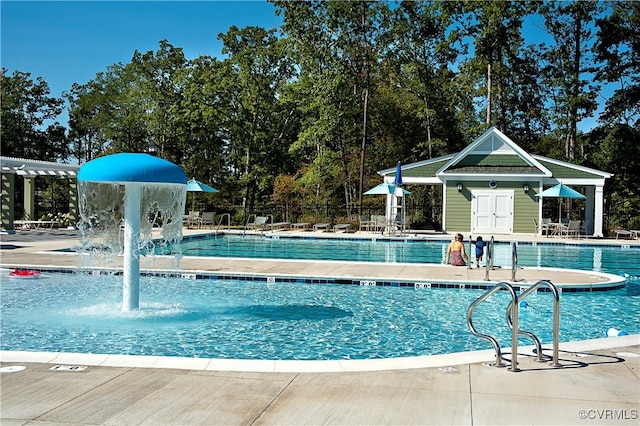 7500 Nicklaus Cir, Moseley, VA 23120 - community pool featuring a patio and view of wooded area