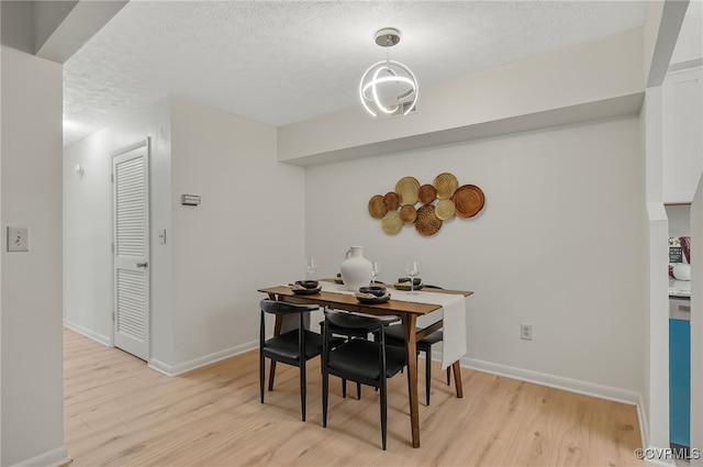 2106 Turtle Run Dr Unit 3, Henrico, VA 23233 - dining area featuring light wood-type flooring, a textured ceiling, and baseboards