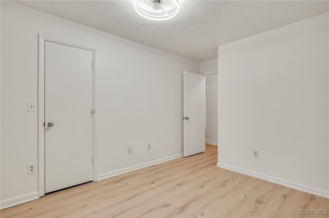 2106 Turtle Run Dr Unit 3, Henrico, VA 23233 - spare room featuring wood finished floors, a textured ceiling, and baseboards