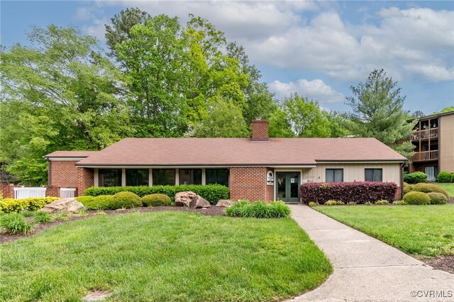 2106 Turtle Run Dr Unit 3, Henrico, VA 23233 - view of front of house featuring a chimney, a front lawn, and brick siding