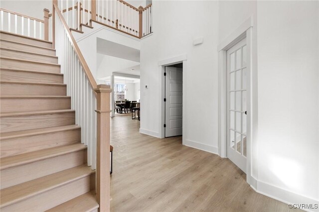 12731 Dell Hill Ct, Chester, VA 23831 - foyer with wood finished floors, stairs, a high ceiling, and baseboards