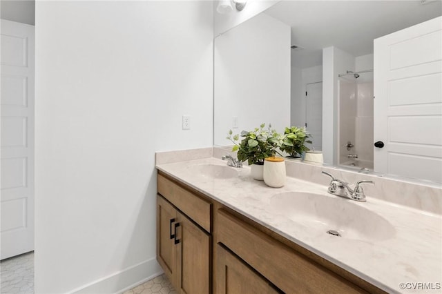 12731 Dell Hill Ct, Chester, VA 23831 - bathroom with double vanity, baseboards, and shower / bath combination