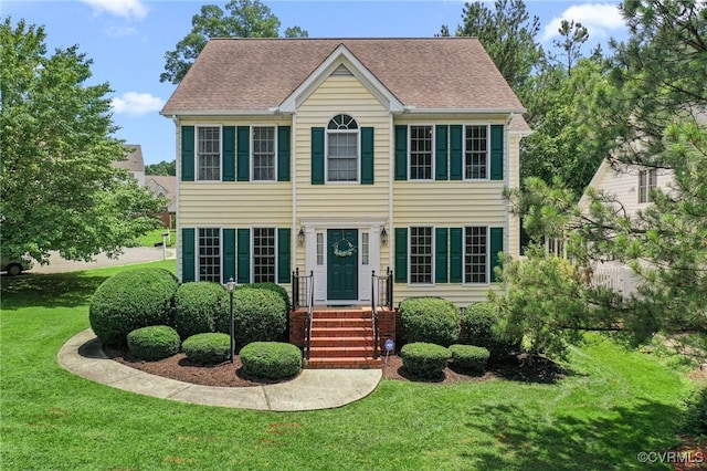 3321 Ceres Rd, Henrico, VA 23294 - colonial-style house featuring a front lawn and roof with shingles