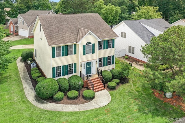 3321 Ceres Rd, Henrico, VA 23294 - colonial-style house featuring a front lawn and roof with shingles