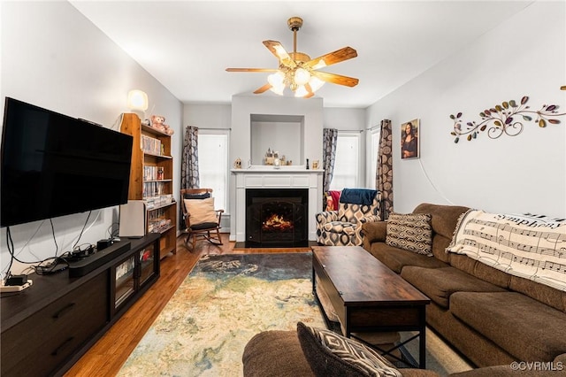 3321 Ceres Rd, Henrico, VA 23294 - living room featuring a ceiling fan, a warm lit fireplace, and wood finished floors