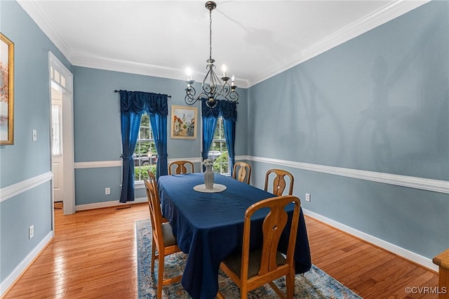3321 Ceres Rd, Henrico, VA 23294 - dining area with a chandelier, light wood-style floors, and ornamental molding
