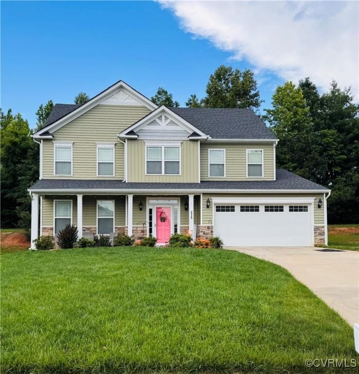 215 Cardinal Rd, Louisa, VA 23093 - view of front of house with stone siding, concrete driveway, a front lawn, a garage, and covered porch