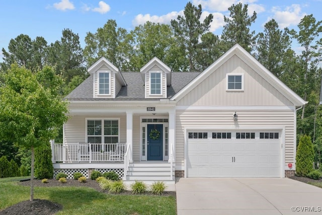 15942 Fishers Green Dr, Chesterfield, VA 23832 - view of front of home with concrete driveway, covered porch, a garage, and a shingled roof