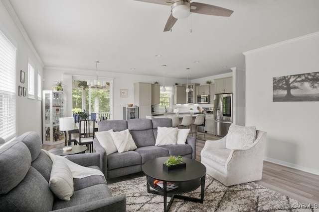 15942 Fishers Green Dr, Chesterfield, VA 23832 - living area featuring light wood-type flooring, ceiling fan, a chandelier, crown molding, and recessed lighting