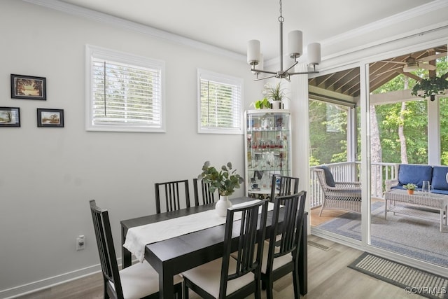 15942 Fishers Green Dr, Chesterfield, VA 23832 - dining room featuring a chandelier, wood finished floors, and crown molding