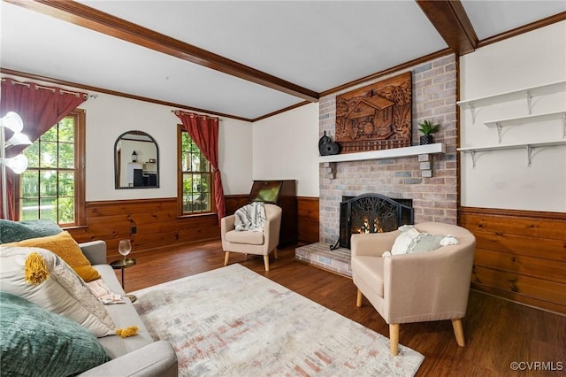 4337 Collingswood Dr, Chesterfield, VA 23832 - living room featuring wainscoting, wood finished floors, crown molding, wood walls, and a brick fireplace