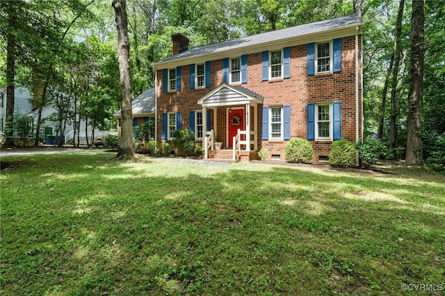 4337 Collingswood Dr, Chesterfield, VA 23832 - colonial house with brick siding, a chimney, a front lawn, and crawl space