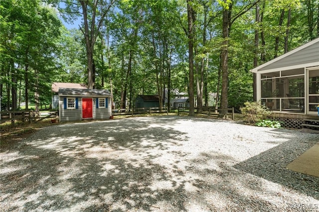 4337 Collingswood Dr, Chesterfield, VA 23832 - view of yard featuring a sunroom, a shed, and view of wooded area