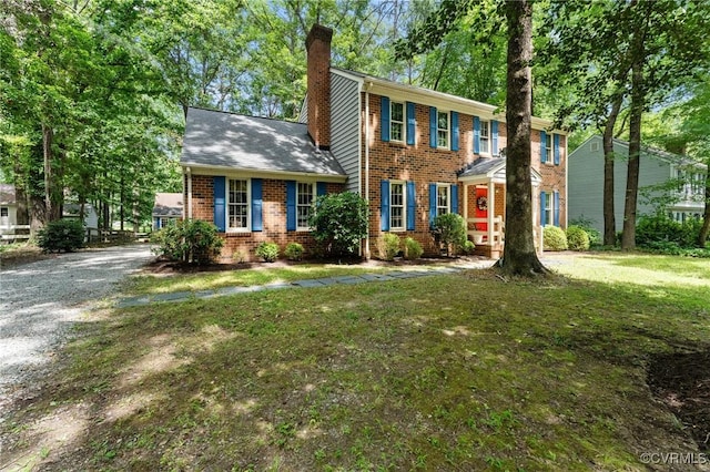 4337 Collingswood Dr, Chesterfield, VA 23832 - colonial inspired home with brick siding, a chimney, and a front yard