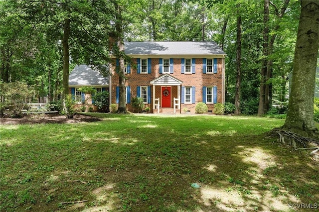 4337 Collingswood Dr, Chesterfield, VA 23832 - colonial house featuring brick siding, a front yard, a chimney, and crawl space