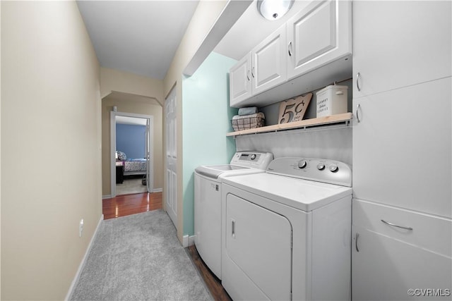 10050 S General Blvd, North Chesterfield, VA 23237 - laundry area featuring cabinet space, independent washer and dryer, dark wood-style flooring, and dark carpet