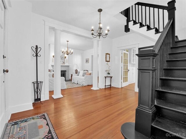 110 Gatewood Ave, Crewe, VA 23930 - entrance foyer with a chandelier, stairway, light wood-type flooring, and baseboards