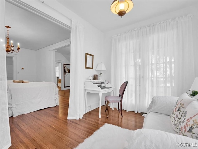 110 Gatewood Ave, Crewe, VA 23930 - living area featuring wood finished floors, a chandelier, and vaulted ceiling