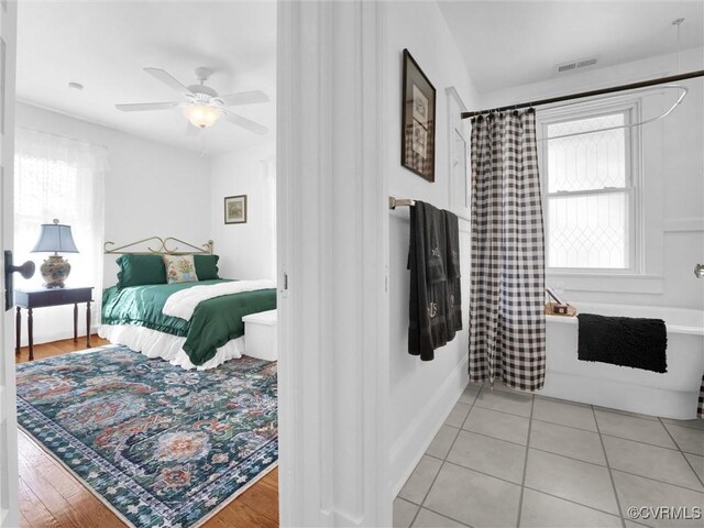 110 Gatewood Ave, Crewe, VA 23930 - bedroom with light tile patterned floors and a ceiling fan