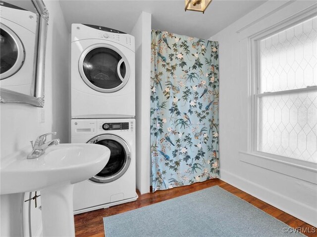 110 Gatewood Ave, Crewe, VA 23930 - washroom featuring stacked washer and clothes dryer and wood finished floors
