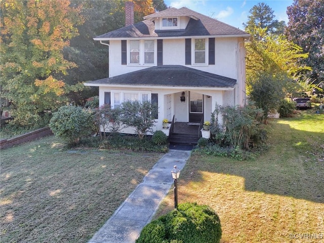 110 Gatewood Ave, Crewe, VA 23930 - traditional style home featuring covered porch, a chimney, stucco siding, and a front yard
