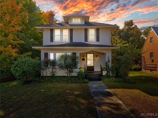 110 Gatewood Ave, Crewe, VA 23930 - traditional style home featuring a chimney, a front yard, stucco siding, and a porch