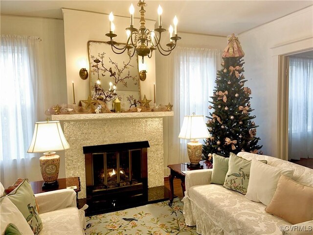 110 Gatewood Ave, Crewe, VA 23930 - living area with a chandelier and a lit fireplace