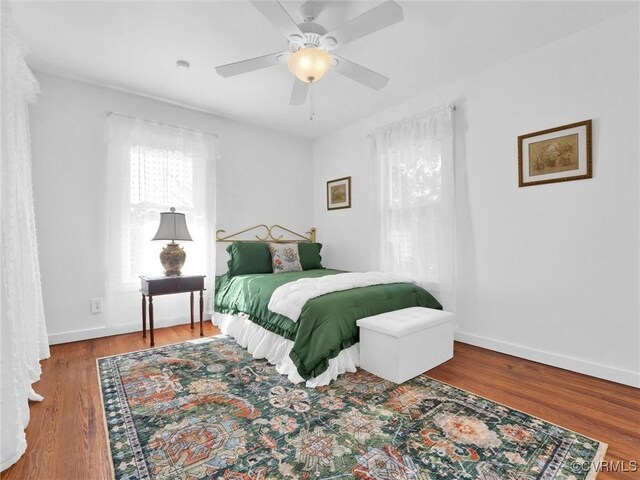 110 Gatewood Ave, Crewe, VA 23930 - bedroom with wood finished floors, baseboards, and ceiling fan